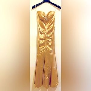 Gold strapless gown with jewel accent bottom seam is separated see photo